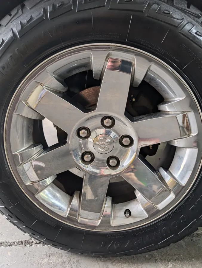 Close up of a polished alloy wheel cleaned during a full detail