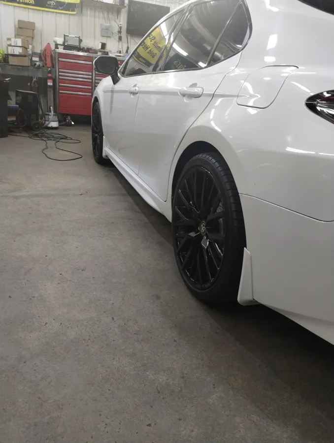White sedan with blacked out wheels detailed in New Oxford, PA