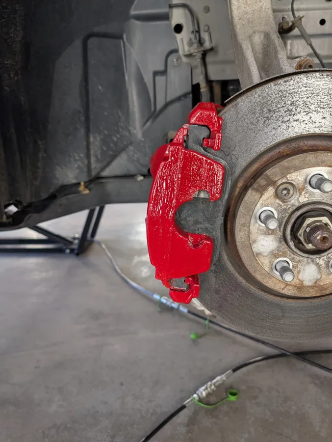 Brake caliper finished in red on a wheel hub