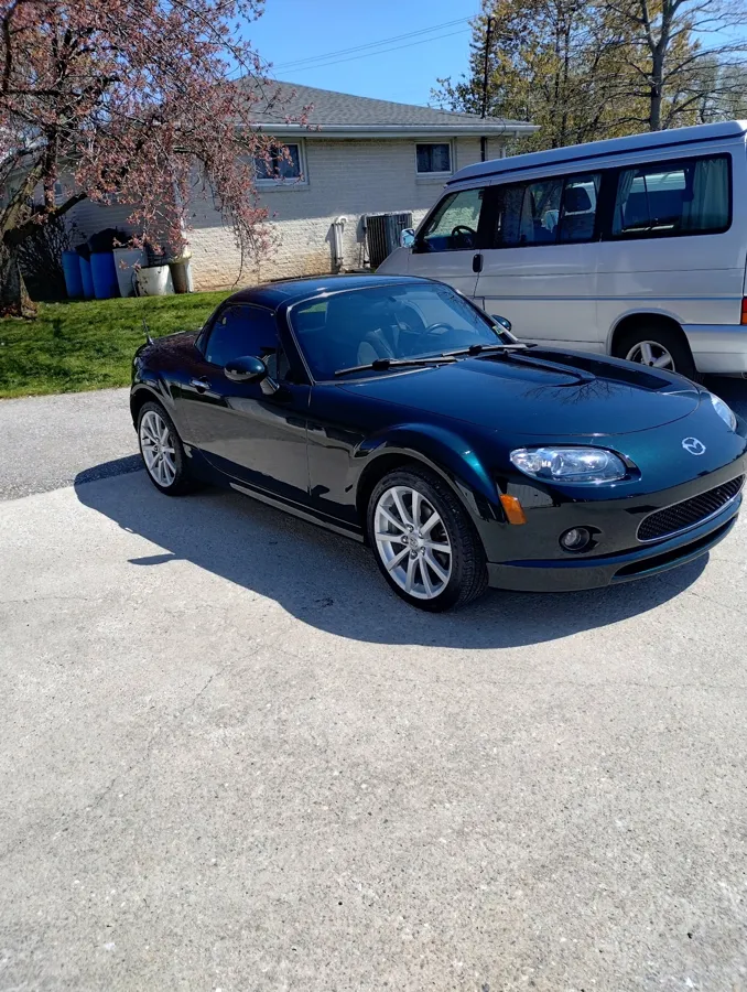 Dark Mazda MX-5 Miata convertible after a Jay Wrapz detail